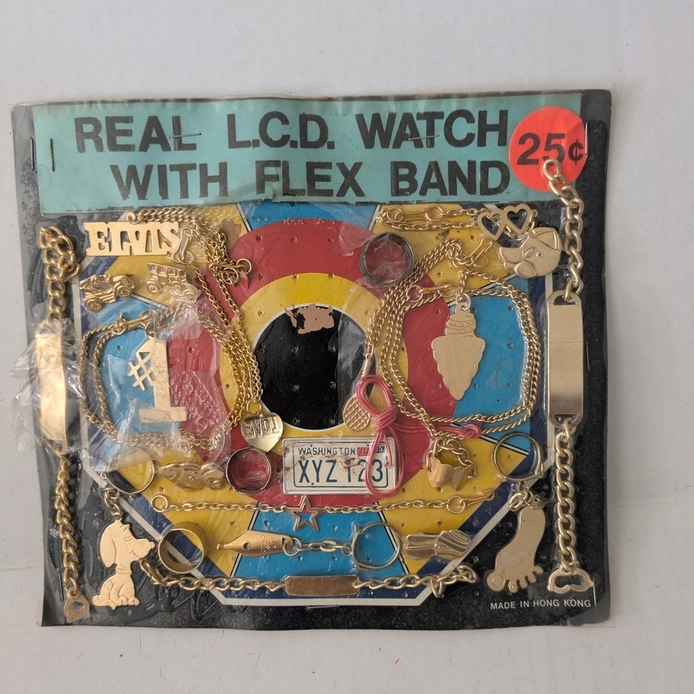 Vintage Gold Tone Vending Machine Toy Bracelet, Necklaces, And Keychains Display